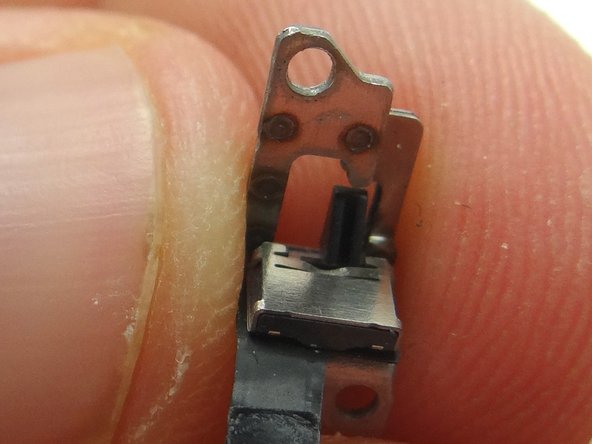 Picture 3: Remove the mute switch bracket from the mute switch. Place mute switch bracket into ZONE V.