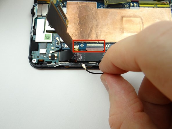 Picture 2: Disconnect antenna cable with the blue pry tool placed exactly where shown.