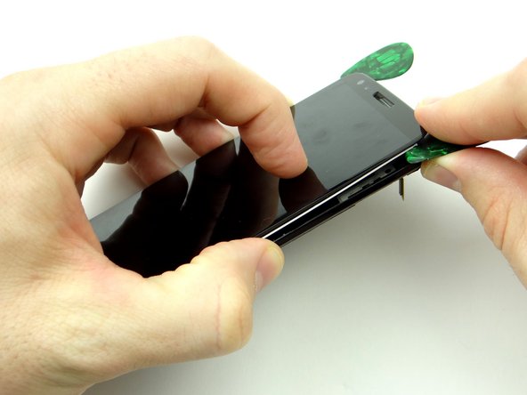 Take care not to torque the mid-frame as you remove the display.