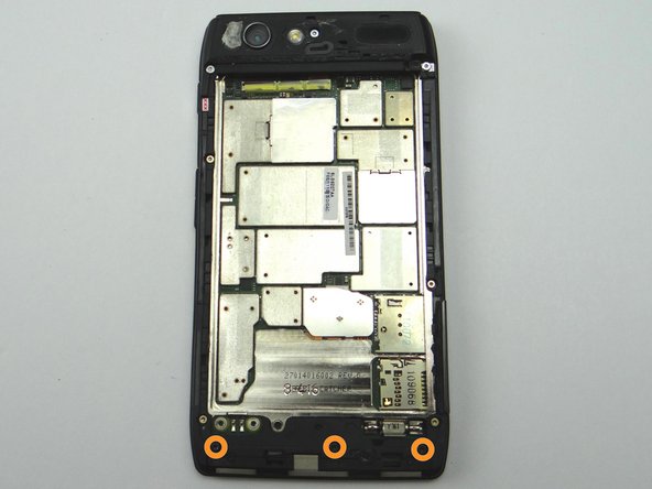 Remove three 4.5 mm black T5 Torx screws and place into SLOT 5.