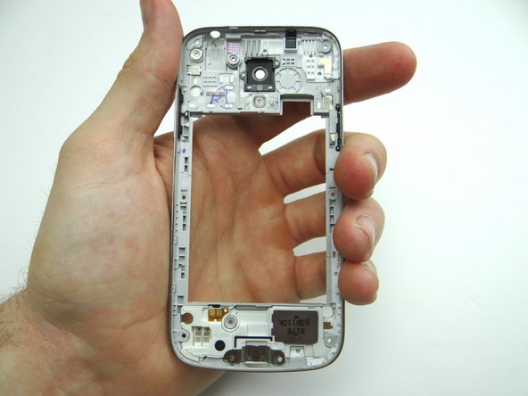 Push out loudspeaker with your fingers.