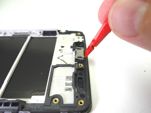 Picture 3: Once loose, remove the speaker with your fingers.  Place in COMPARTMENT D.