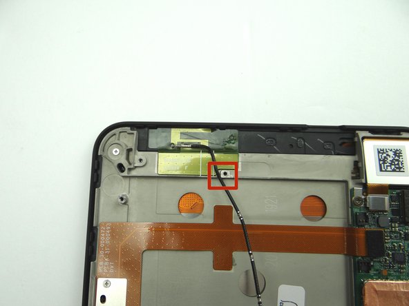 Lay the cable next to the screw socket as pictured.