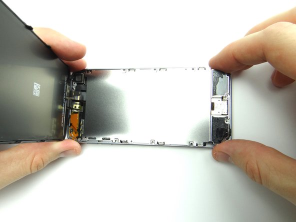 Lift metal plate from bottom taking care to feed home button through its slot.