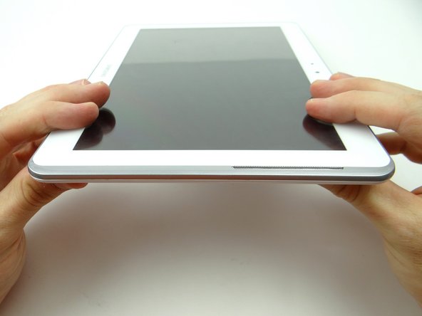 Examine all edges to ensure all clips are seated and the display is flush with the rear case.