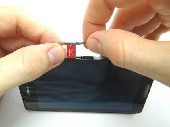 From COMPARTMENT A, replace tray, SIM card and SD card.