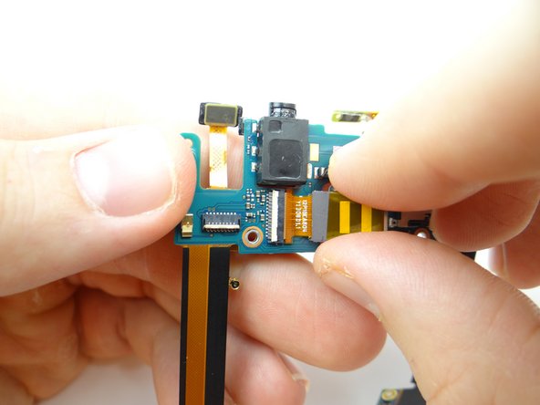 Push rear camera cable into open ZIF connector.