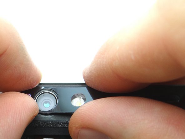 Retrieve the rear camera trim from COMPARTMENT C.  Starting from the left side, reapply the rear camera trim and press firmly to resecure it to the phone.