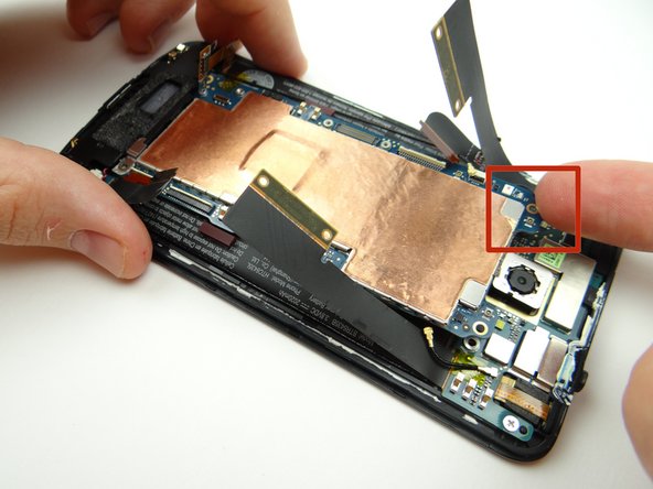 Lift corner of logic board slightly.