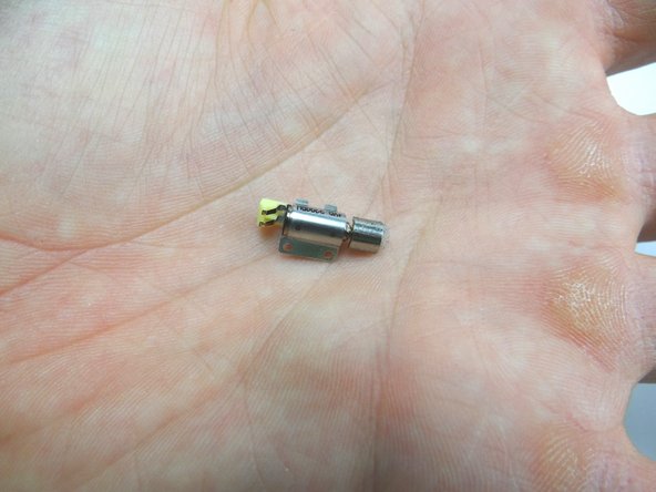 Remove the vibrator with your fingers.  Place it with screws in COMPARTMENT B.