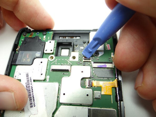 Picture 1: Use blue pry tool to open headphone jack ZIF connector.