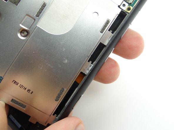 Seat the mid-plate clips in the rear case.