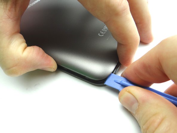 Picture 1: Insert near the corner as shown and gently twist to pry up.