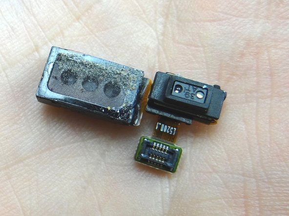 Place earpiece speaker / proximity sensor assembly in COMPARTMENT C.