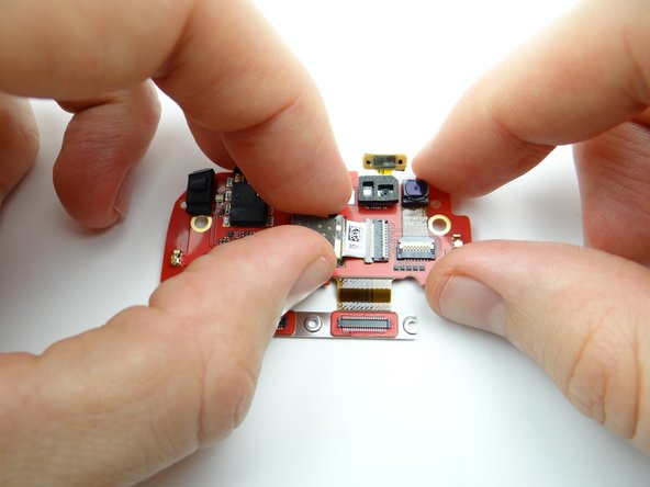 Slide rear camera cable into open ZIF connector.