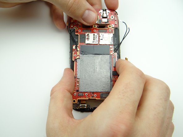 Lift the connector bar up and out of the way as you carefully remove the logic board from the front panel.