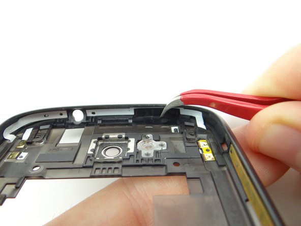 Seat the power button in the mid-body using the orientation pictured.