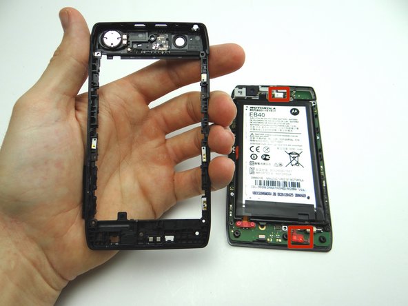 Seat the mid-frame from ZONE II on the display assembly.