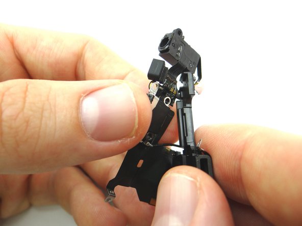 Picture 1: Unravel at the bottom to begin separation of the speaker assembly / charging port.