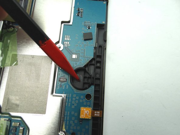 Picture 1: Use blue pry tool to disconnect vibrator cable.