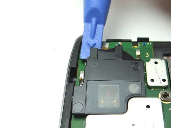 Pry up the speaker cover and place in COMPARTMENT D.