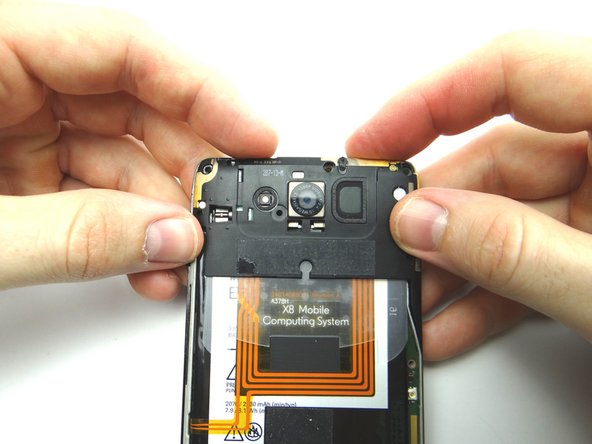 Push the marked clip into place.