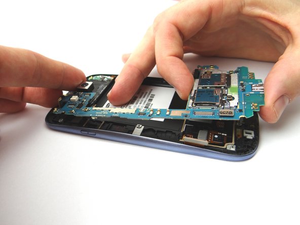 Brush away cable connectors from the logic board, as you remove it, to avoid ripping them.