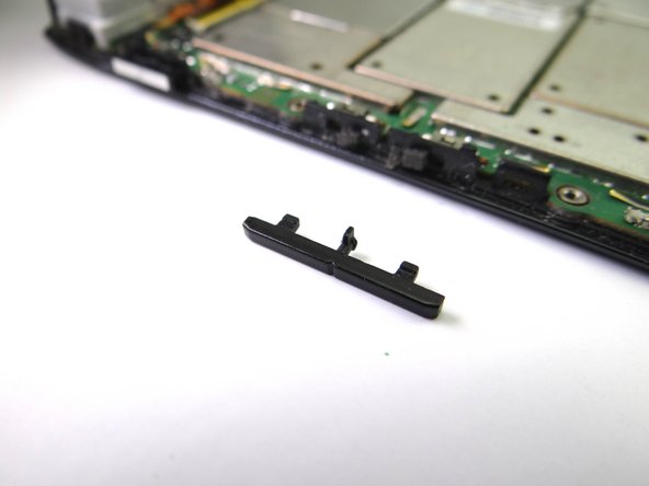 Picture 2: Note the orientation of the volume rocker: line up the tabs on the volume rocker with the corresponding slots on the front panel.