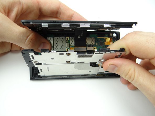 Seat the mid-plate clips in the rear case.