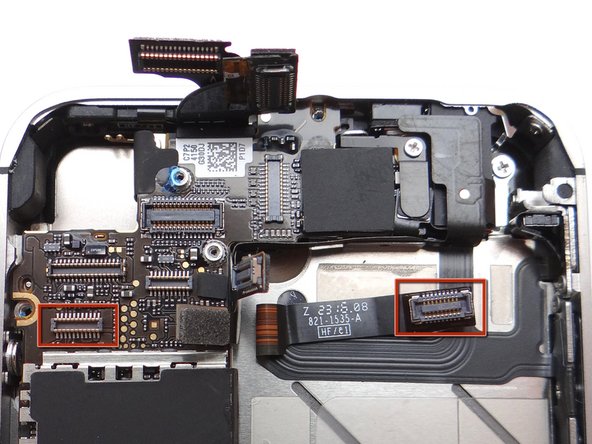 Picture 3: Reconnect the long cable: position the long cable (pinned to the mid-frame) over top of the power button cable.  (Cable head and socket are outlined in red).