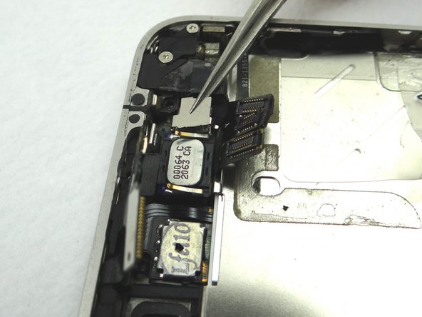 Remove front-facing camera plate and place in COMPARTMENT E.