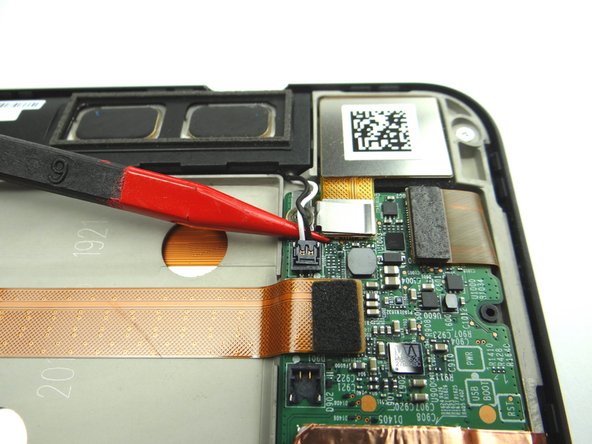 Picture 3: Remove one 3.1 mm #00 Phillips screw.  Place in SLOT 3.