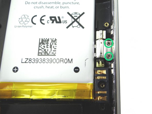 Also from COMPARTMENT B, replace two 1.9 mm Phillips screws to secure vibrator.