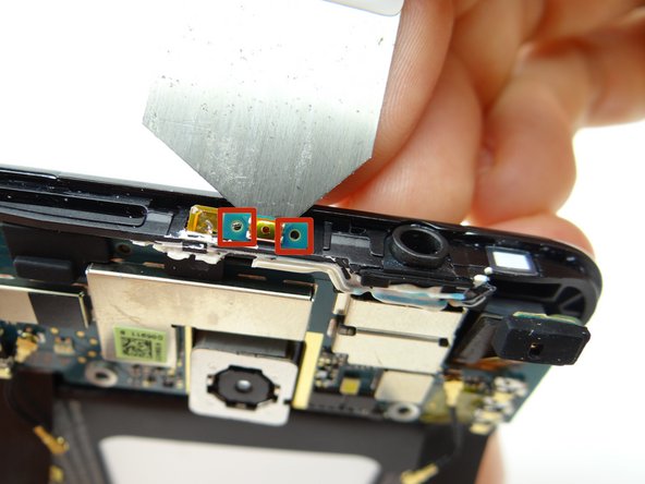 Power button is connected to the daughter board and is adhered to the mid-panel: