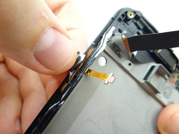 Replace tape from the back wall of COMPARTMENT C to hold the cable in place.