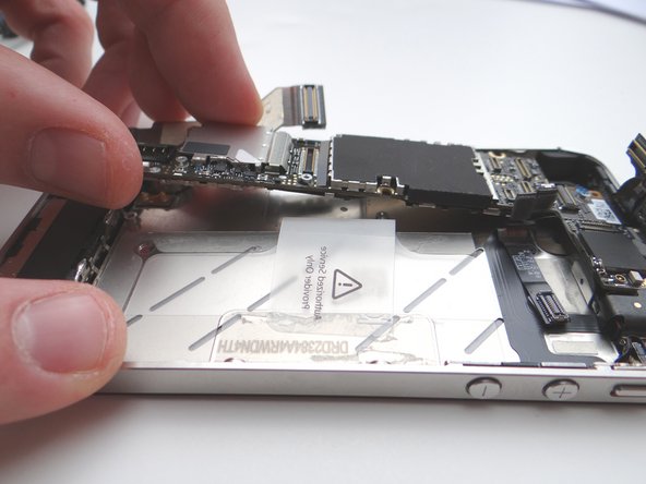 Picture 1: Grab the logic board from ZONE III and carefully position the top edge into the mid-frame.  Make sure the top edge is below the protruding tab on the mid-frame.
