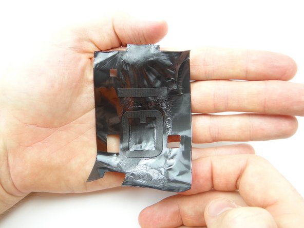 From ZONE I, cover the logic board with black tape.