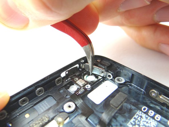 Picture 2: Shut the power button door. It will be stiff in a couple areas.