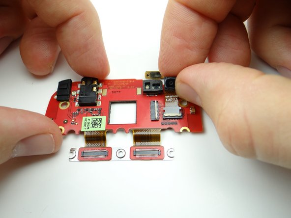 Slide front-facing camera cable into open ZIF connector.