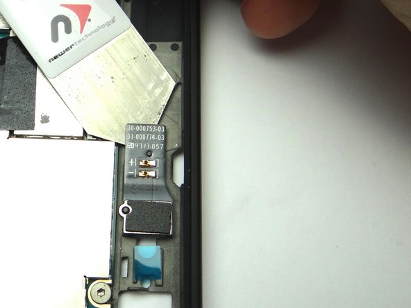 Pry up the corner of the rear camera flash with the iSesamo tool just enough to grab it with your fingers.