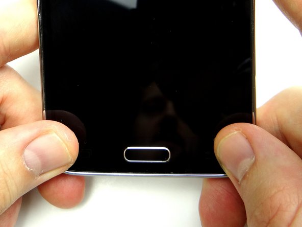 Picture 3: Close the screen on the mid-frame, guiding the home button through the opening on the screen.