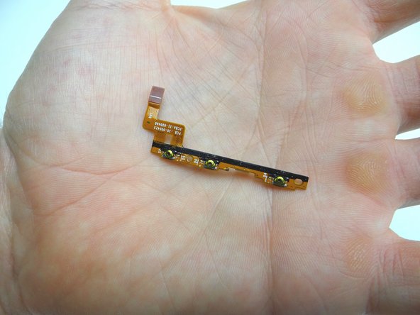 Seat the volume &amp; power cable from COMPARTMENT E.  Adhere it to the inside wall of the display.