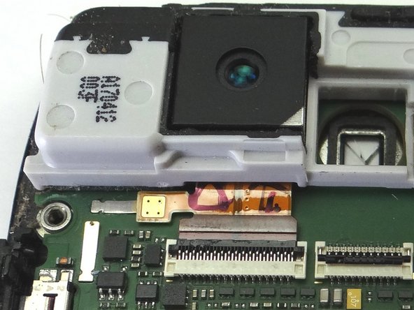 Picture 1: Make sure the white line on the rear camera cable lines up with the back of the ZIF connector.