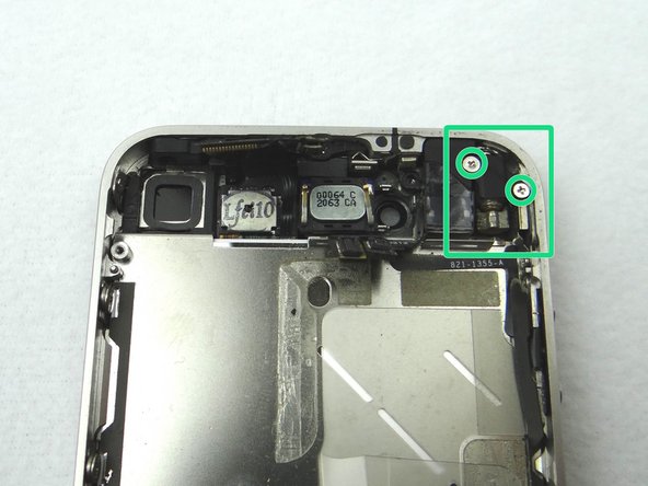 Picture 1: Remove 6 mm Phillips screw on the left.  Remove 1.4 mm Phillips screw on the right.  Remove vibrator.  Place all three in COMPARTMENT D.