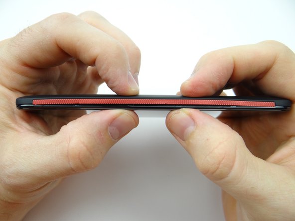 Work your way around the perimeter making sure all battery cover clips are snapped in place.