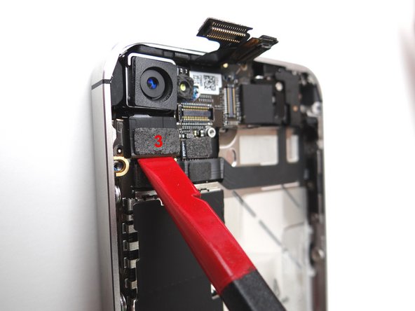 Be careful not to break any components off the surrounding area on the logic board as you pry upwards.