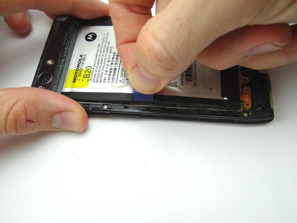 Picture 1: Grab the battery removal tab and gently lift up just enough to wedge a spudger underneath.