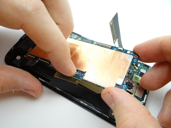 Pictures 2 &amp; 3: Continue pulling logic board free, brushing cables out of the way as you go.