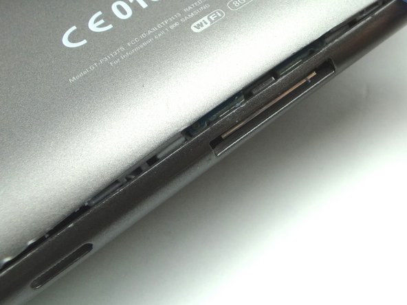 Picture 3: Check each edge to make sure the clips are pushed down.  Double-check near the charging port.