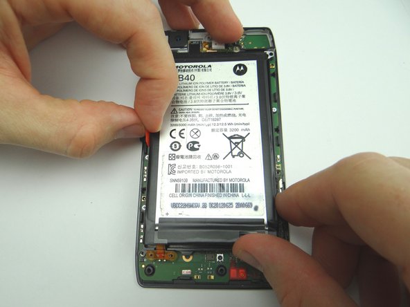 Use the battery removal tab to finish removing the battery once it's nearly free.  Place it in ZONE III.